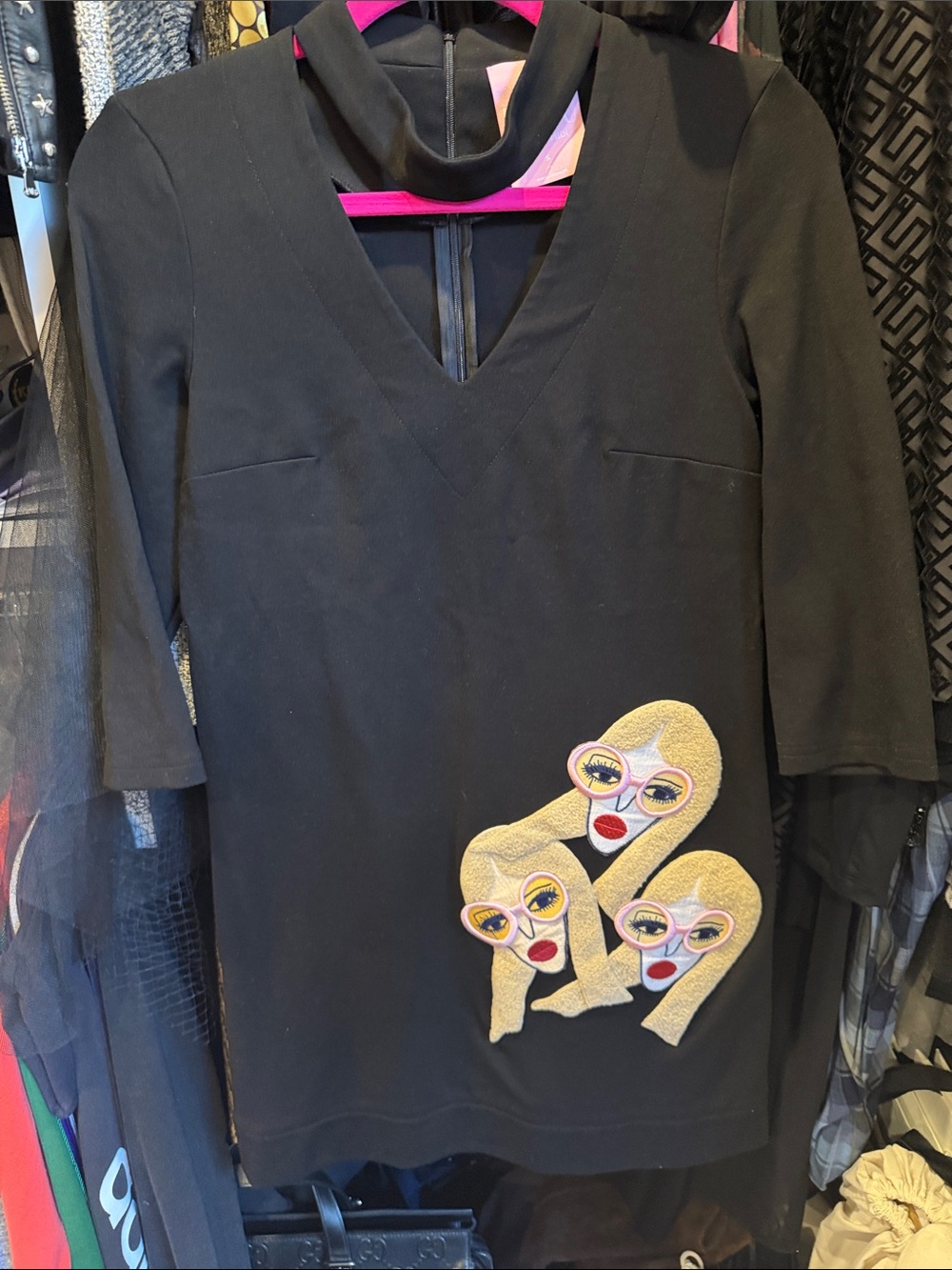 Black Women’s V‑Neck Top with Embroidered Blonde Faces